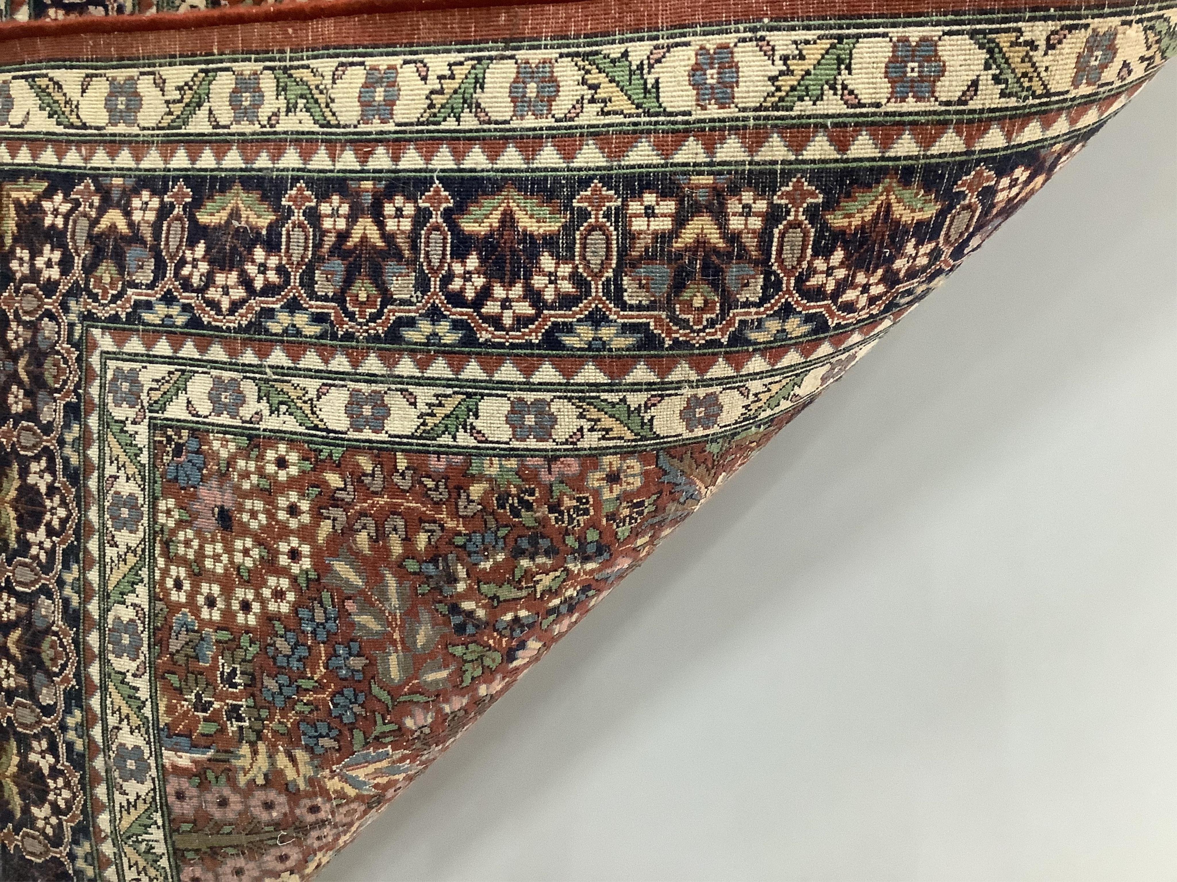 A Persian russet ground rug, 160 x 93cm. Condition - light wear to fringes, otherwise good